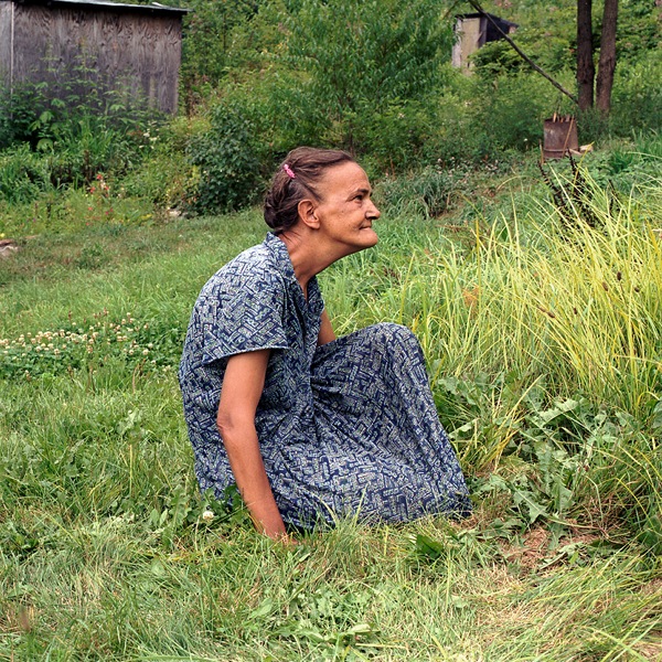 Elder Woman Seated in grass